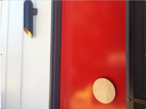 Timber entry handle on red door