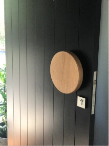 Large round handle on paneled door