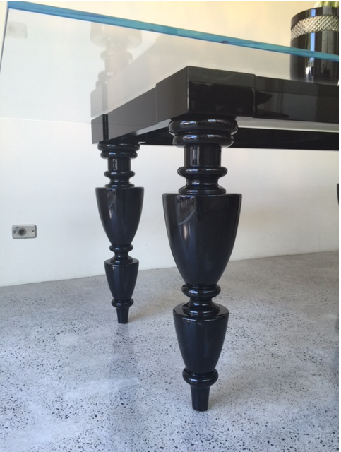 Turned table legs on glass top table